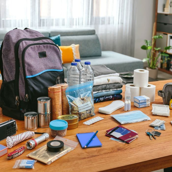 Emergency backpack equipment organized on the table